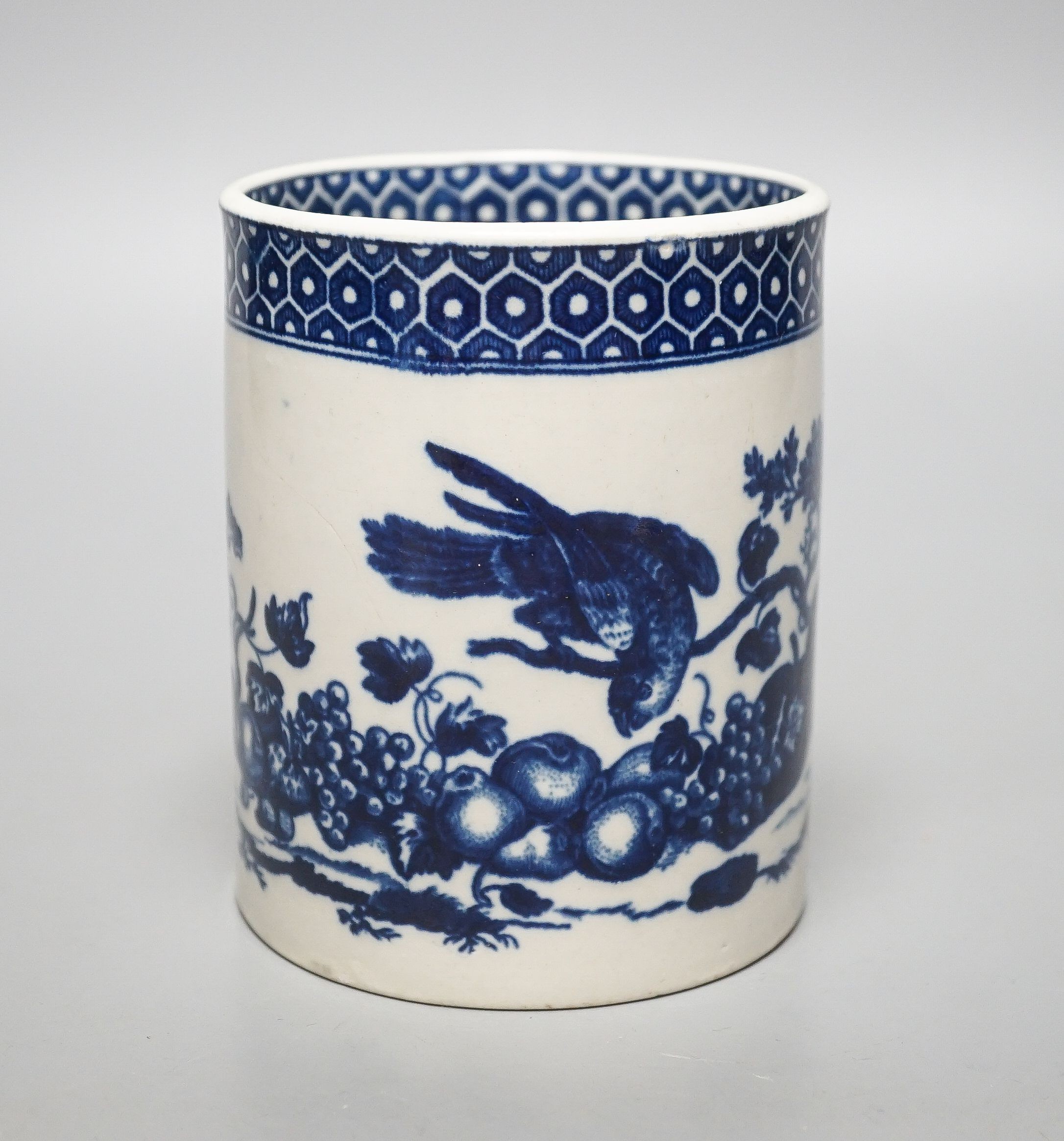 A Worcester cylindrical mug, parrot pecking fruit pattern c.1770, 11.5cm high